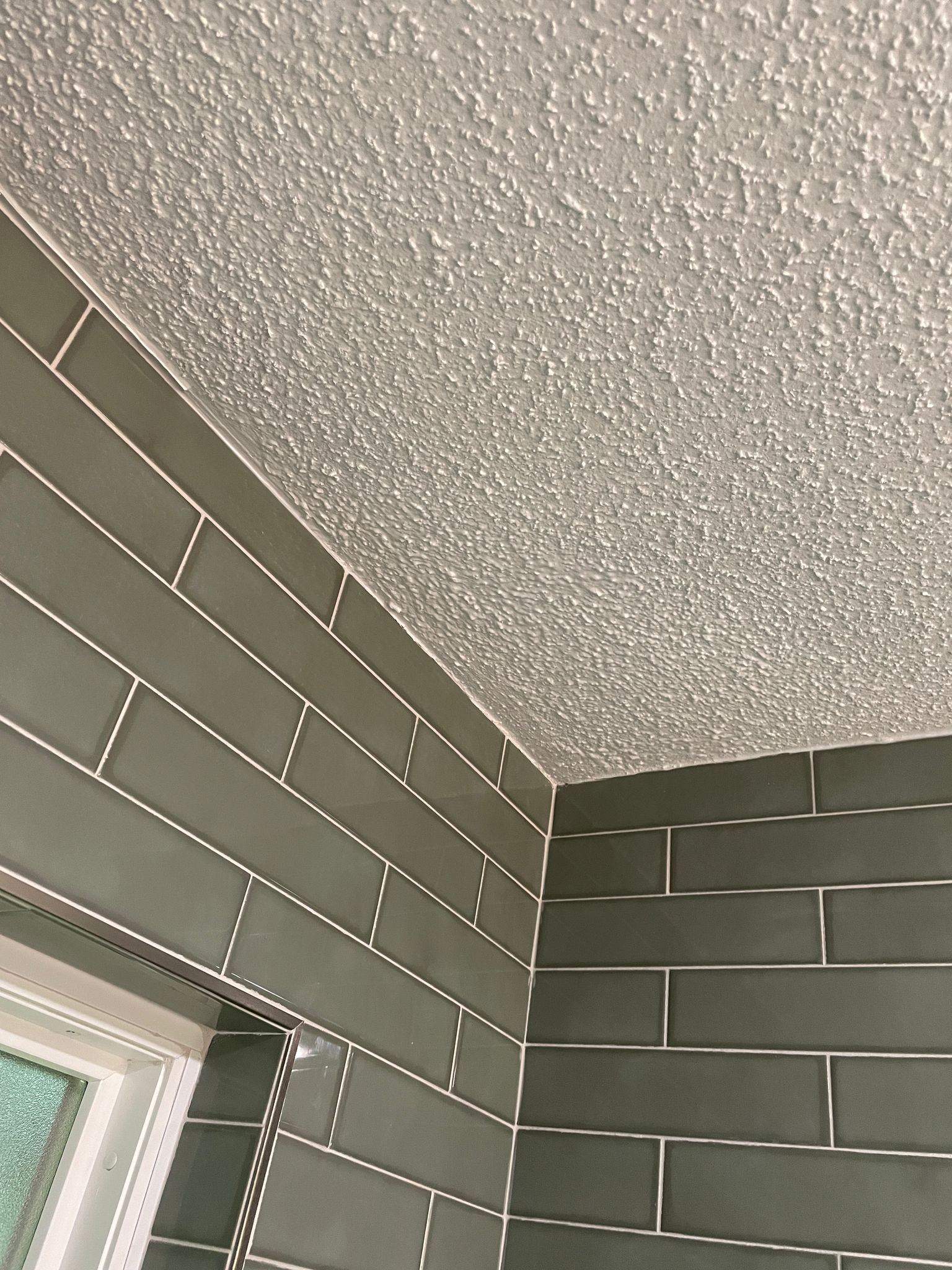 Remodeled walk-in shower after tub removal, featuring modern design