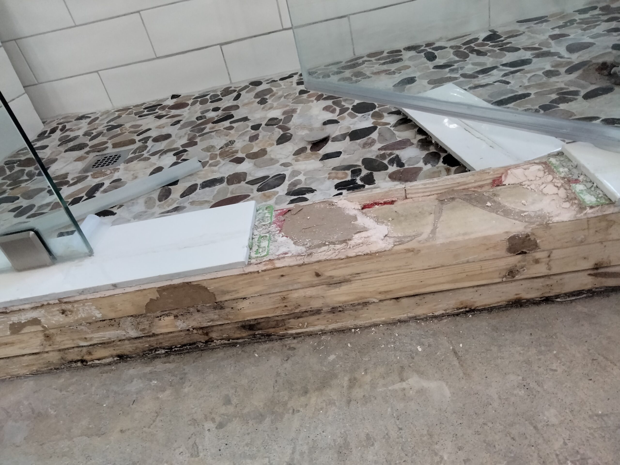 Improperly installed shower with no shower liner and failed waterproofing requiring complete rebuild